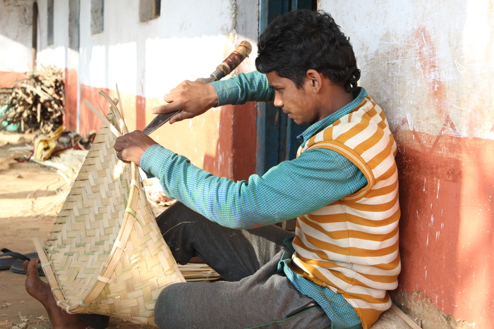 Handy craft<br><br>A young man makes a winnower using bamboo harvested in local hill forests in Lohaghat, Uttarakhand, India. ITTO Fellow Deepti Verma has helped assess the potential of non-timber forest products as a source of livelihoods in the area.<br>
<br>
<em>Photo: D. Verma/ITTO Fellow</em>